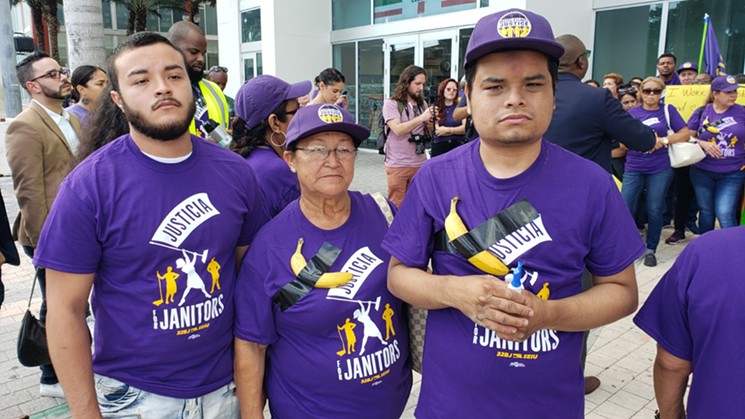 Maria Galindo stands between her sons at Wednesday's protest.