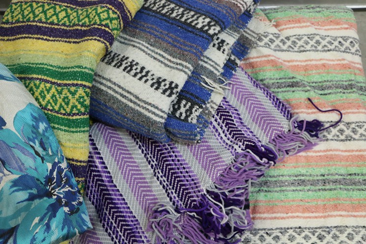 A colorful Mexican throw can go great on the body when Miami's winter temperatures dip and great on the wall as art decor during the rest of the year.