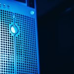Modern server rack with blue lighting in a secure data center, representing enterprise data protection.